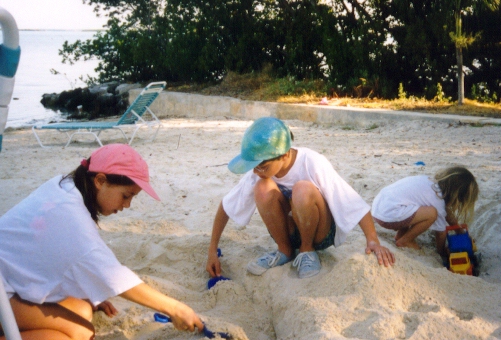 The girls digging on the beach