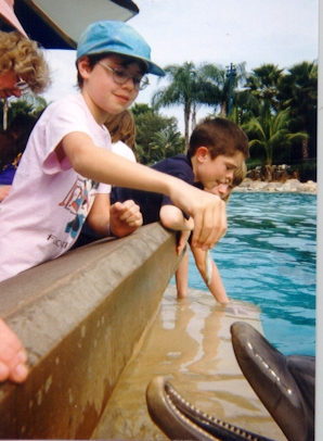 Kathryn Feeds a Dolphin at Sea World